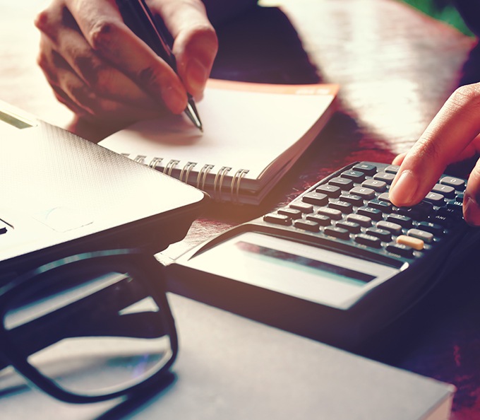 Woman using a calculator