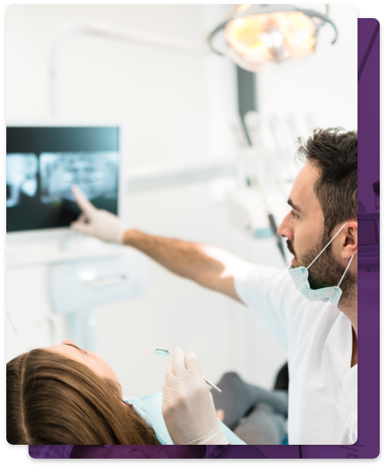 Dentist showing a patient x rays of their teeth