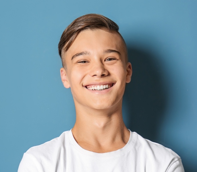 Smiling teenage boy in white tee shirt